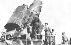 Crew adjusting the barrel